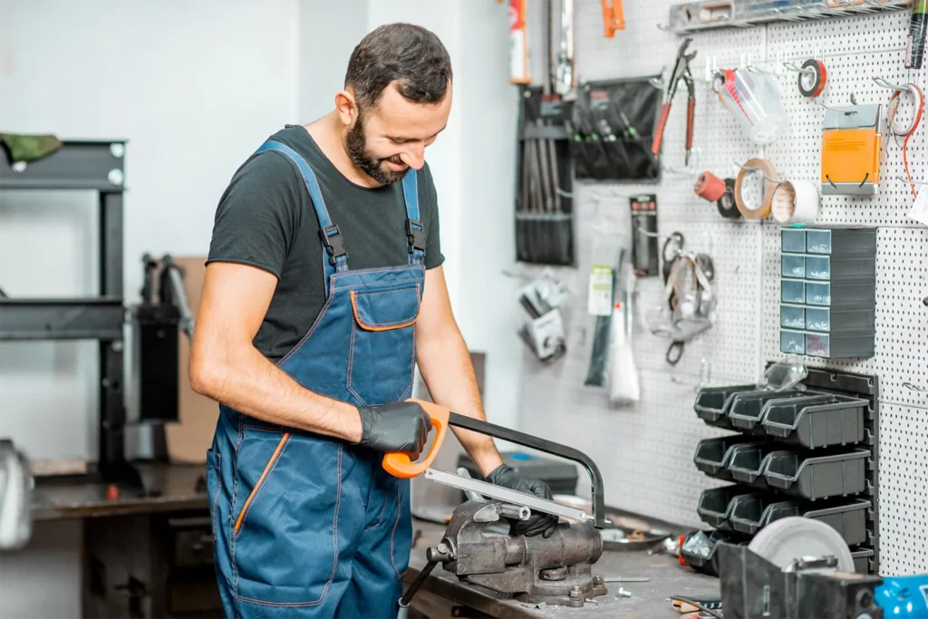 Handyman working with metal at the workshop
