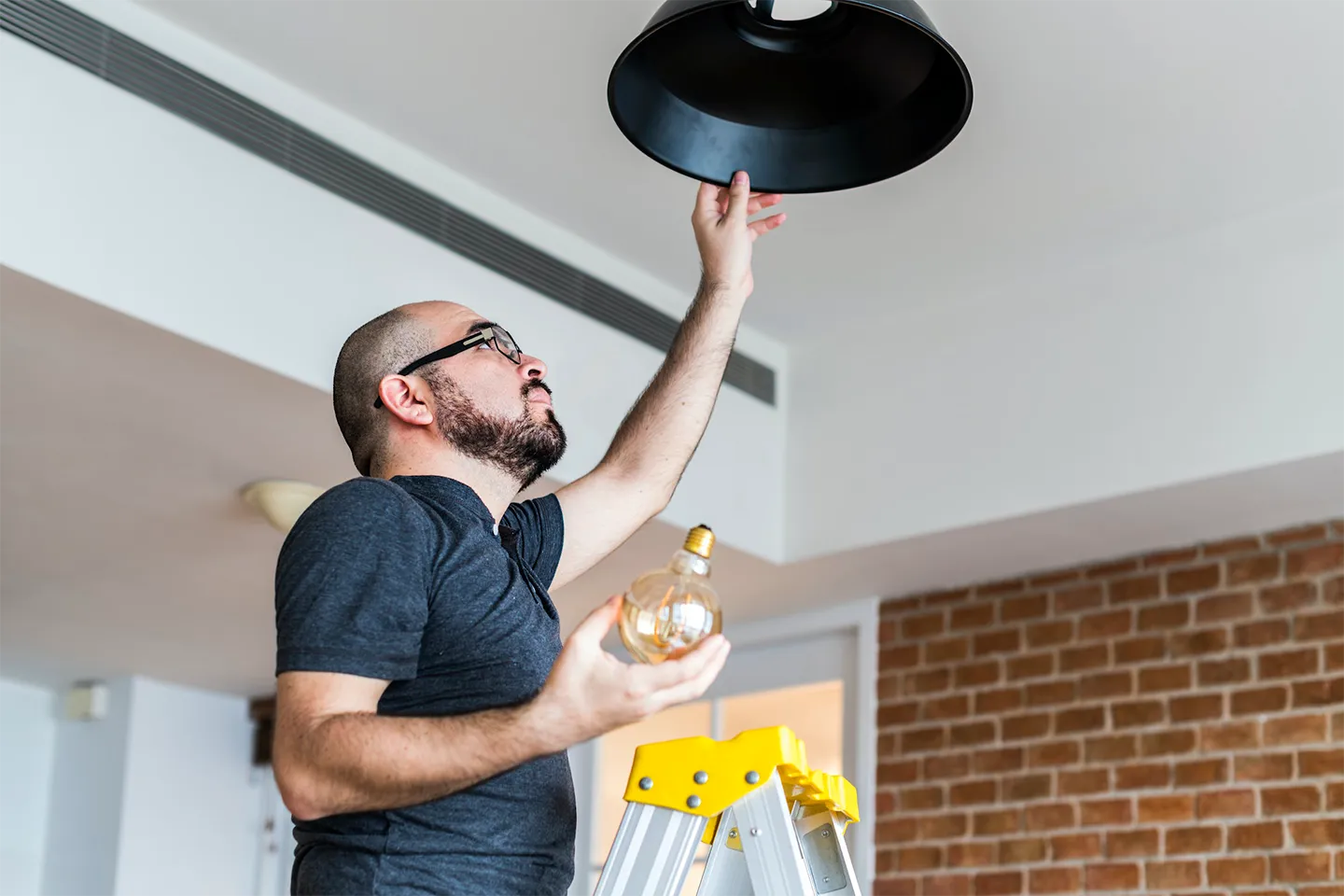 Man changing lightbulb
