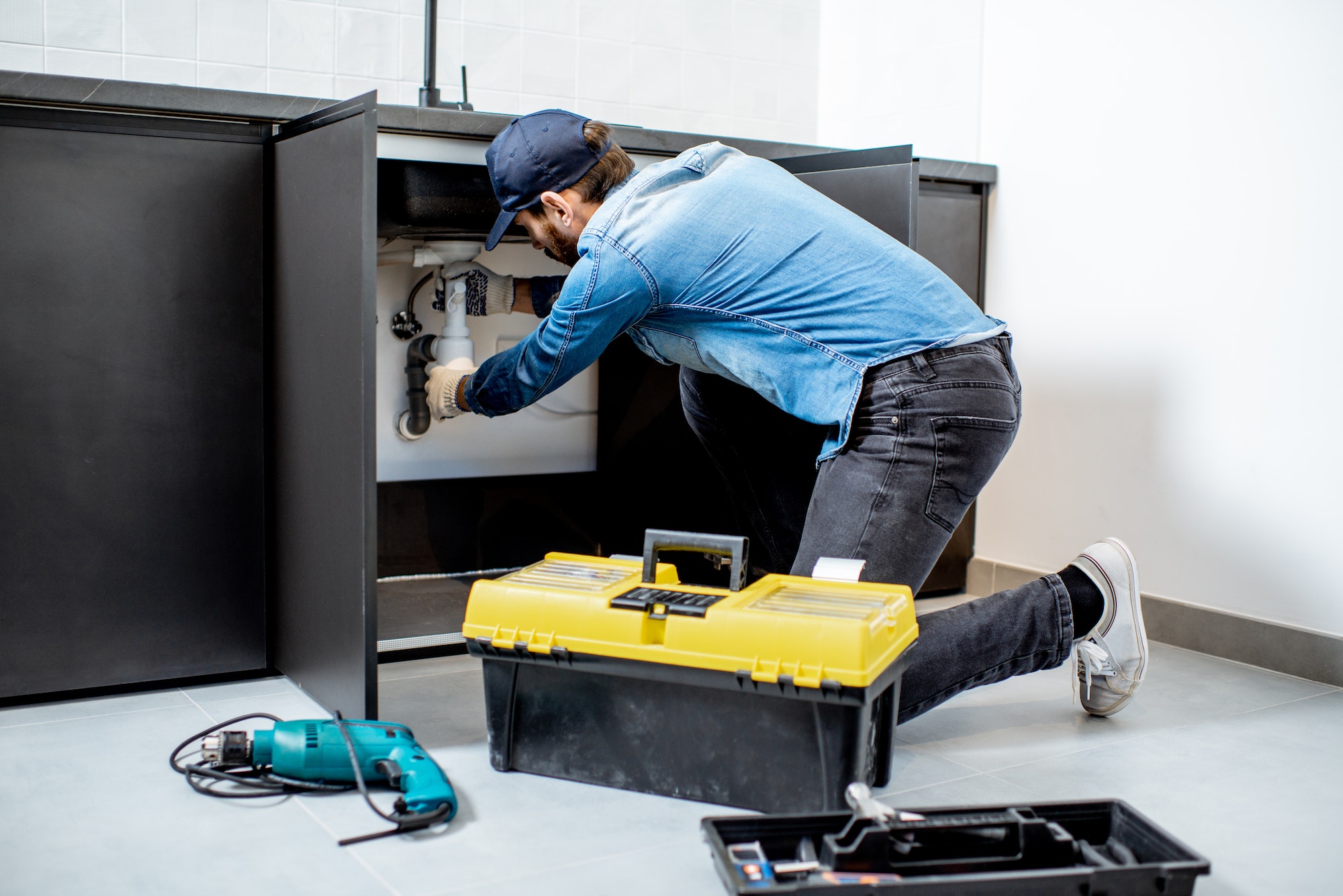 man-repairing-kitchen-furniture-4