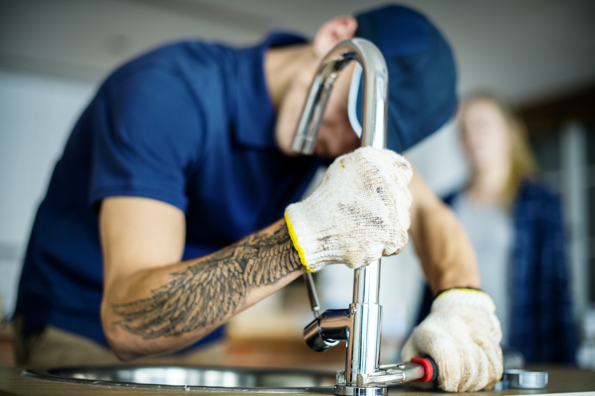 plumber-fixing-kitchen-sink